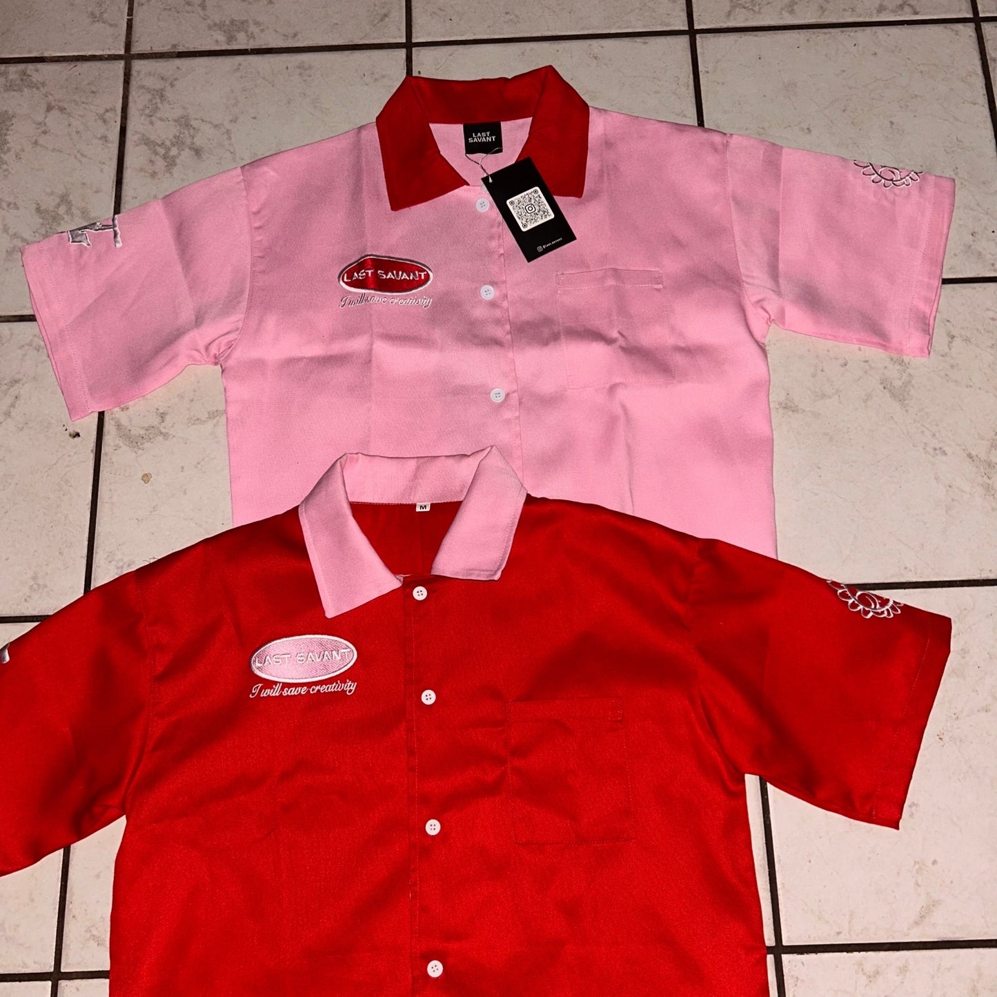 Unisex organic cotton t-shirt with chest and sleeve embroidery – model wearing size Small